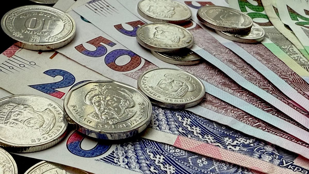 Close-up of various coins and banknotes from different countries, showcasing diversity in currency.